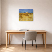 Gallery-wrapped canvas print of Vincent van Gogh's Harvest in Provence displayed on a wall in a home office