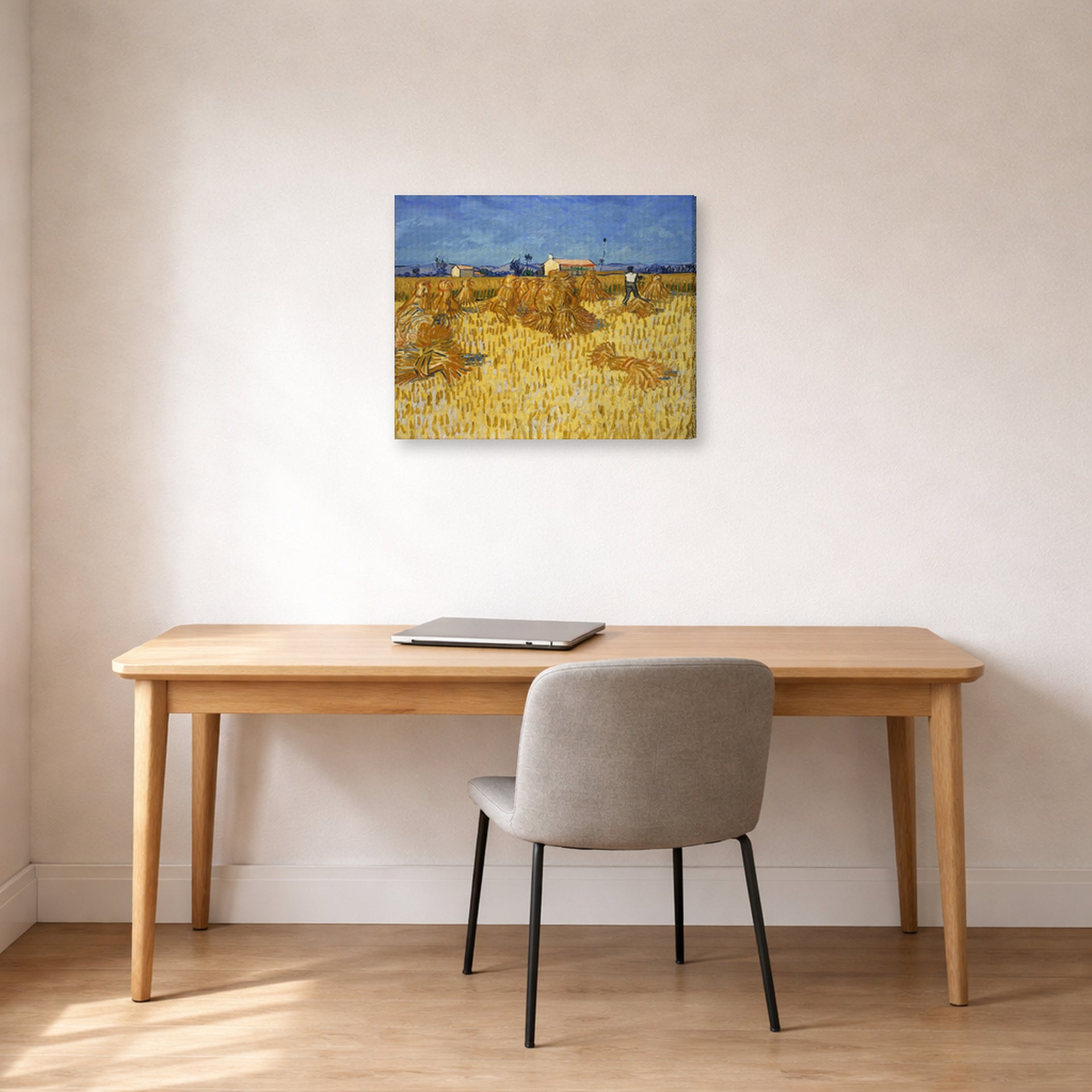Gallery-wrapped canvas print of Vincent van Gogh's Harvest in Provence displayed on a wall in a home office