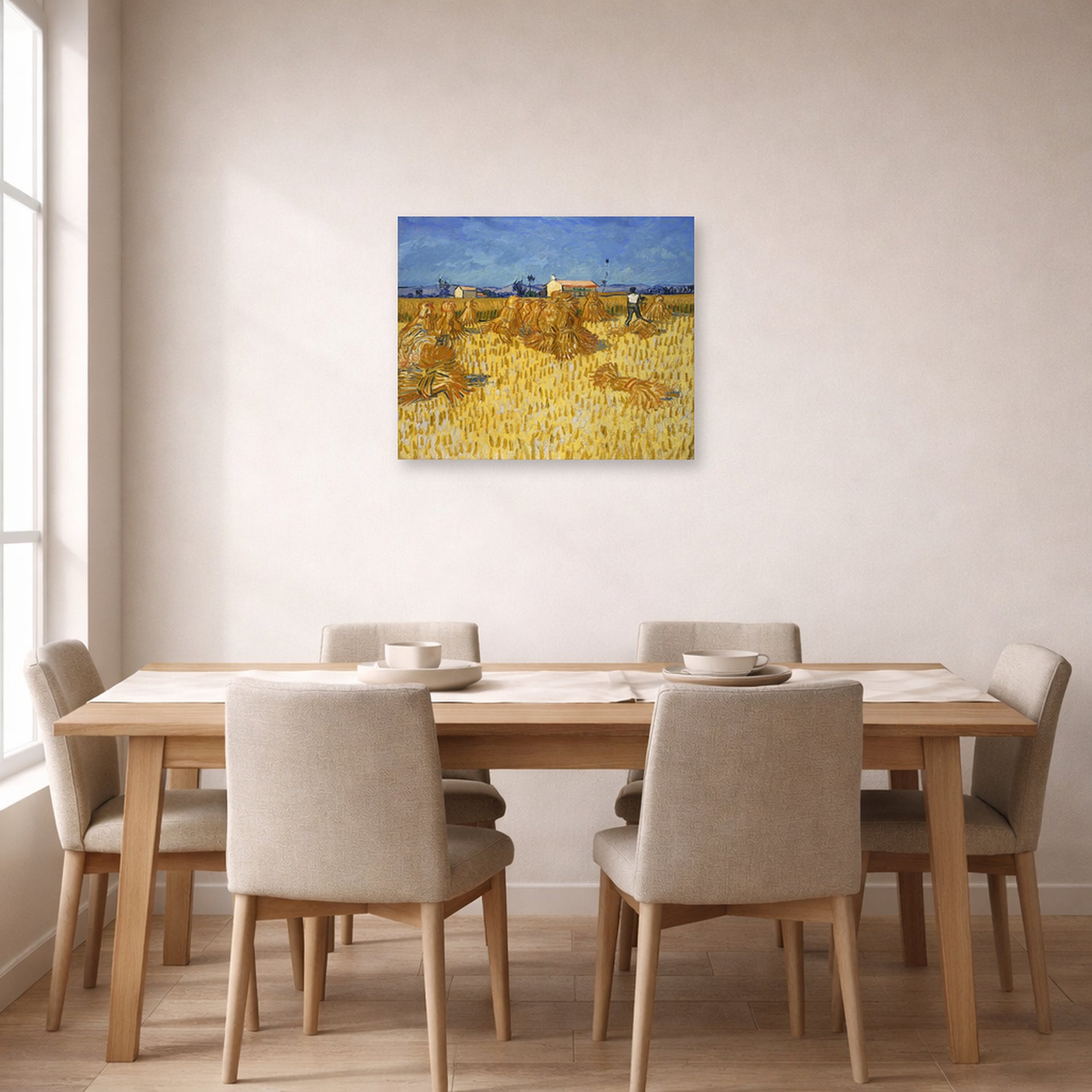 Unframed poster print of Vincent van Gogh's Harvest in Provence displayed on a wall in a dining room