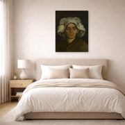 Gallery-wrapped canvas print of Vincent van Gogh's Head of a Woman displayed on a wall in a bedroom