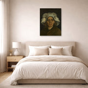 Unframed poster print of Vincent van Gogh's Head of a Woman displayed on a wall in a bedroom