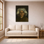 Unframed poster print of Vincent van Gogh's Head of a Woman displayed on a wall in a living room