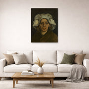 Unframed poster print of Vincent van Gogh's Head of a Woman displayed on a wall in a living room