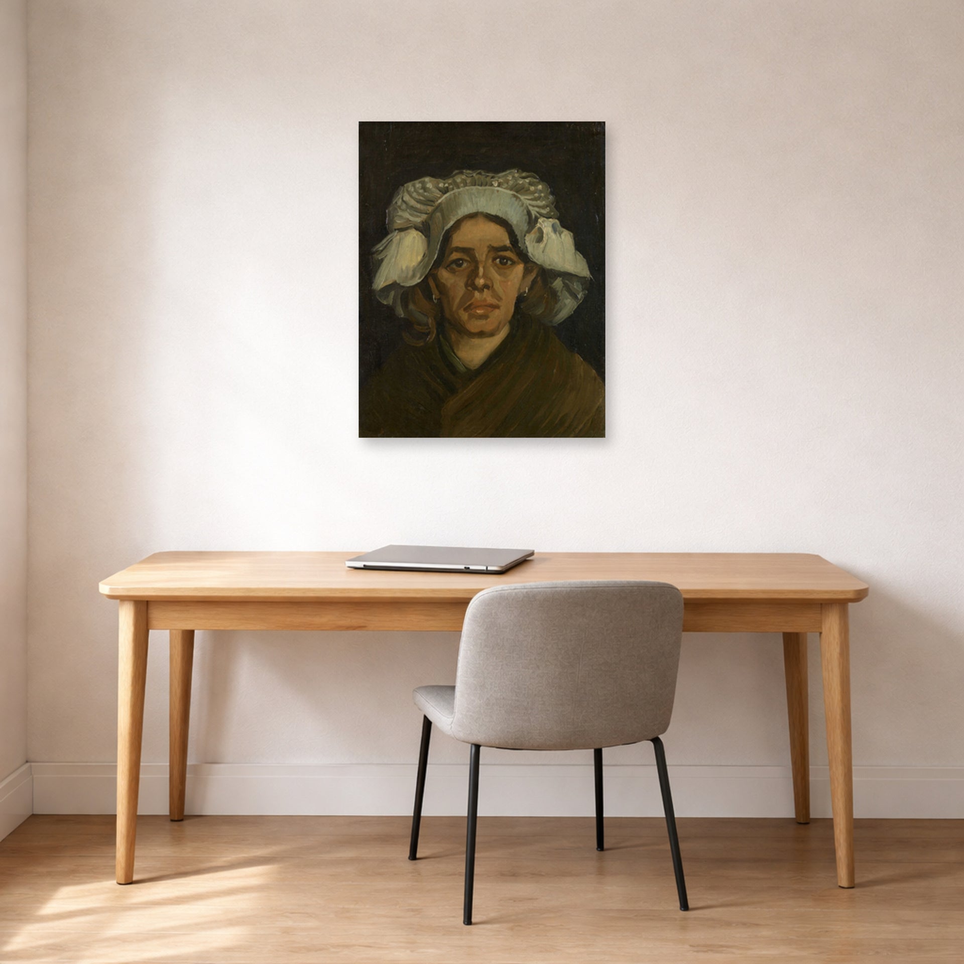 Unframed poster print of Vincent van Gogh's Head of a Woman displayed on a wall in a home office