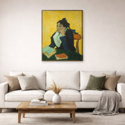 Gallery-wrapped canvas print of Vincent van Gogh's L'arlesienne: Madame Ginoux with Gloves and Umbrella displayed on a wall in a living room