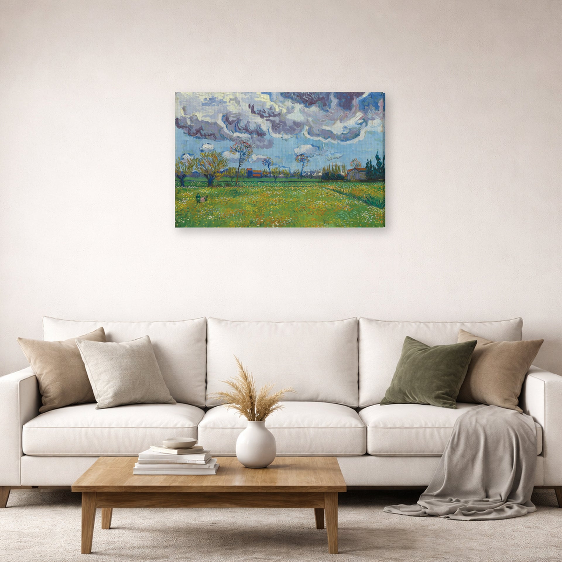 Gallery-wrapped canvas print of Vincent van Gogh's Landscape Under a Stormy Sky displayed on a wall in a living room