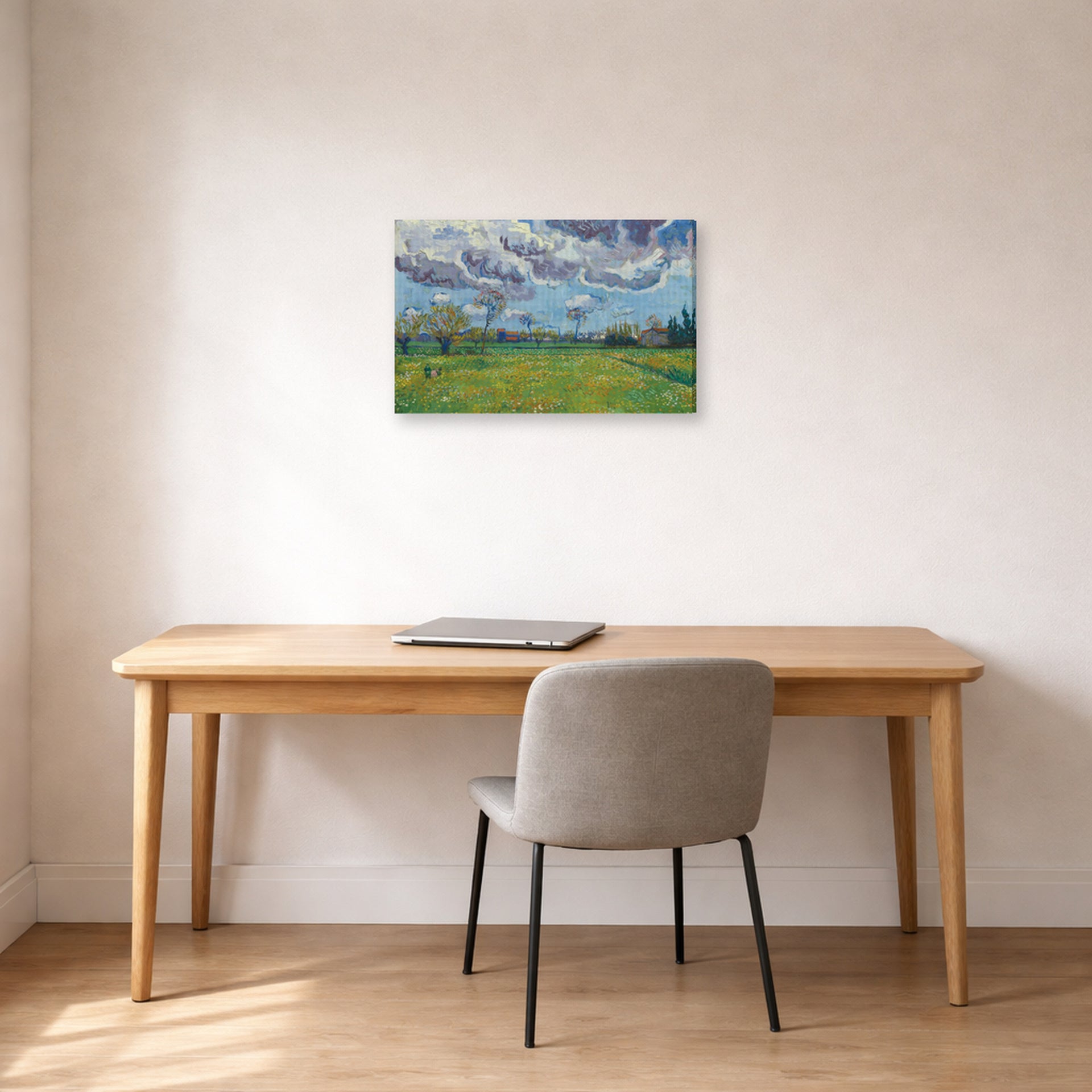 Gallery-wrapped canvas print of Vincent van Gogh's Landscape Under a Stormy Sky displayed on a wall in a home office