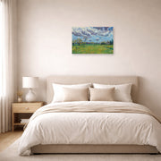 Unframed poster print of Vincent van Gogh's Landscape Under a Stormy Sky displayed on a wall in a bedroom