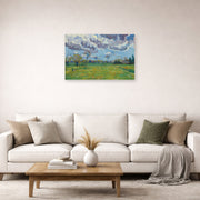 Unframed poster print of Vincent van Gogh's Landscape Under a Stormy Sky displayed on a wall in a living room