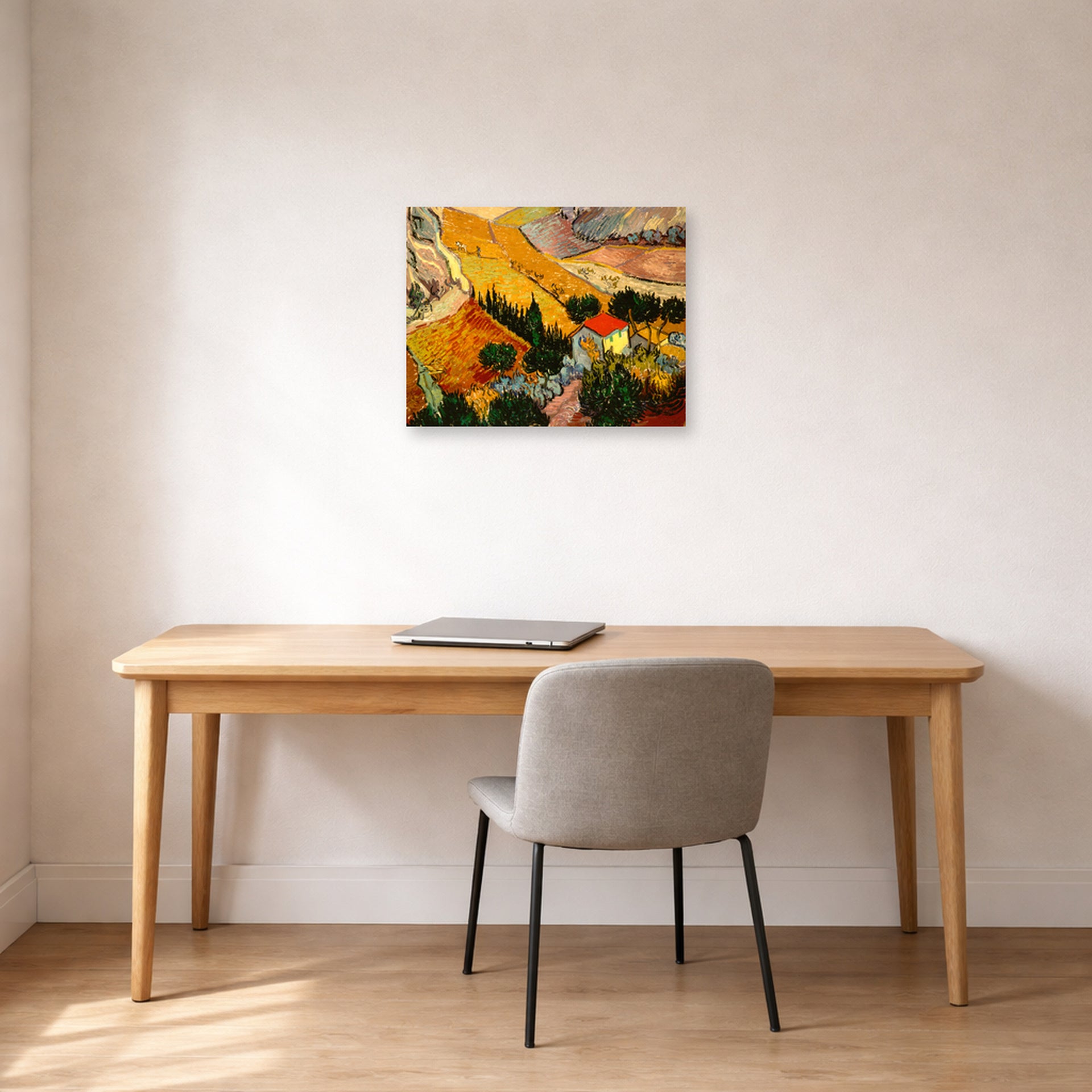 Unframed poster print of Vincent van Gogh's Landscape with House and Ploughman displayed on a wall in a home office