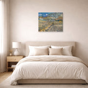 Gallery-wrapped canvas print of Vincent van Gogh's Landscape at Saint Rimy displayed on a wall in a bedroom