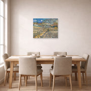 Unframed poster print of Vincent van Gogh's Landscape at Saint Rimy displayed on a wall in a dining room