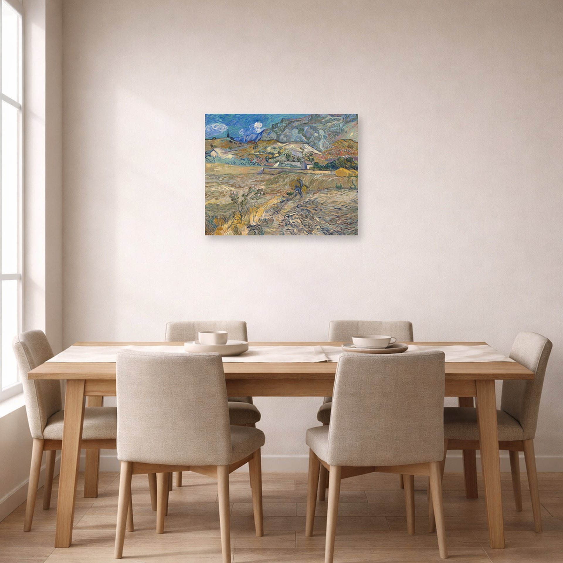 Unframed poster print of Vincent van Gogh's Landscape at Saint Rimy displayed on a wall in a dining room