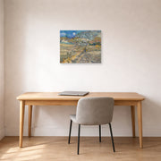 Unframed poster print of Vincent van Gogh's Landscape at Saint Rimy displayed on a wall in a home office