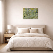 Gallery-wrapped canvas print of Vincent van Gogh's Large Plane Trees displayed on a wall in a bedroom