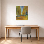 Unframed poster print of Vincent van Gogh's Les Alyscamps displayed on a wall in a home office