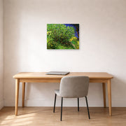 Unframed poster print of Vincent van Gogh's Lilacs displayed on a wall in a home office