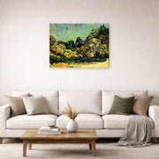 Gallery-wrapped canvas print of Vincent van Gogh's Mountains at Saint Remy with Dark Cottage displayed on a wall in a living room