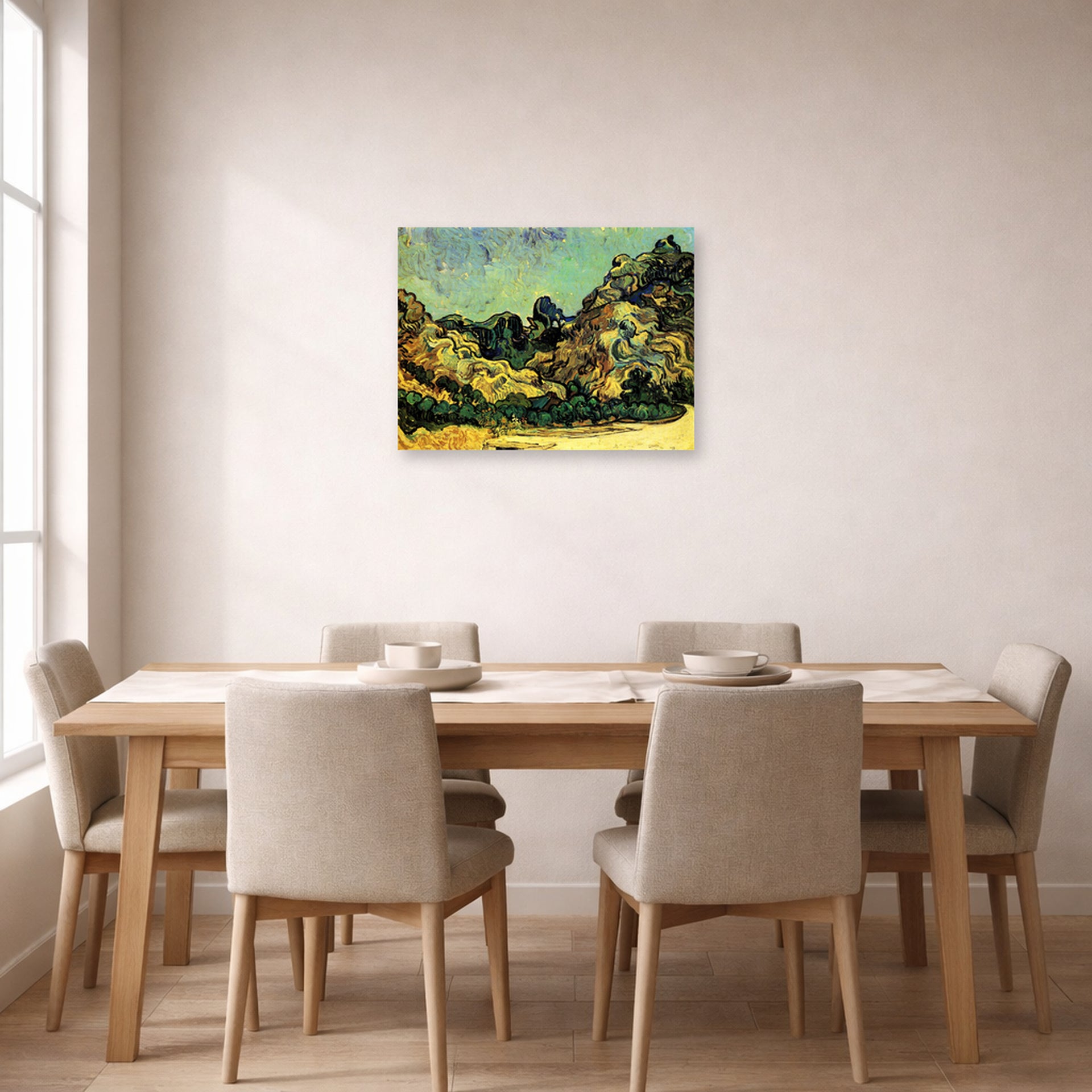 Unframed poster print of Vincent van Gogh's Mountains at Saint Remy with Dark Cottage displayed on a wall in a dining room