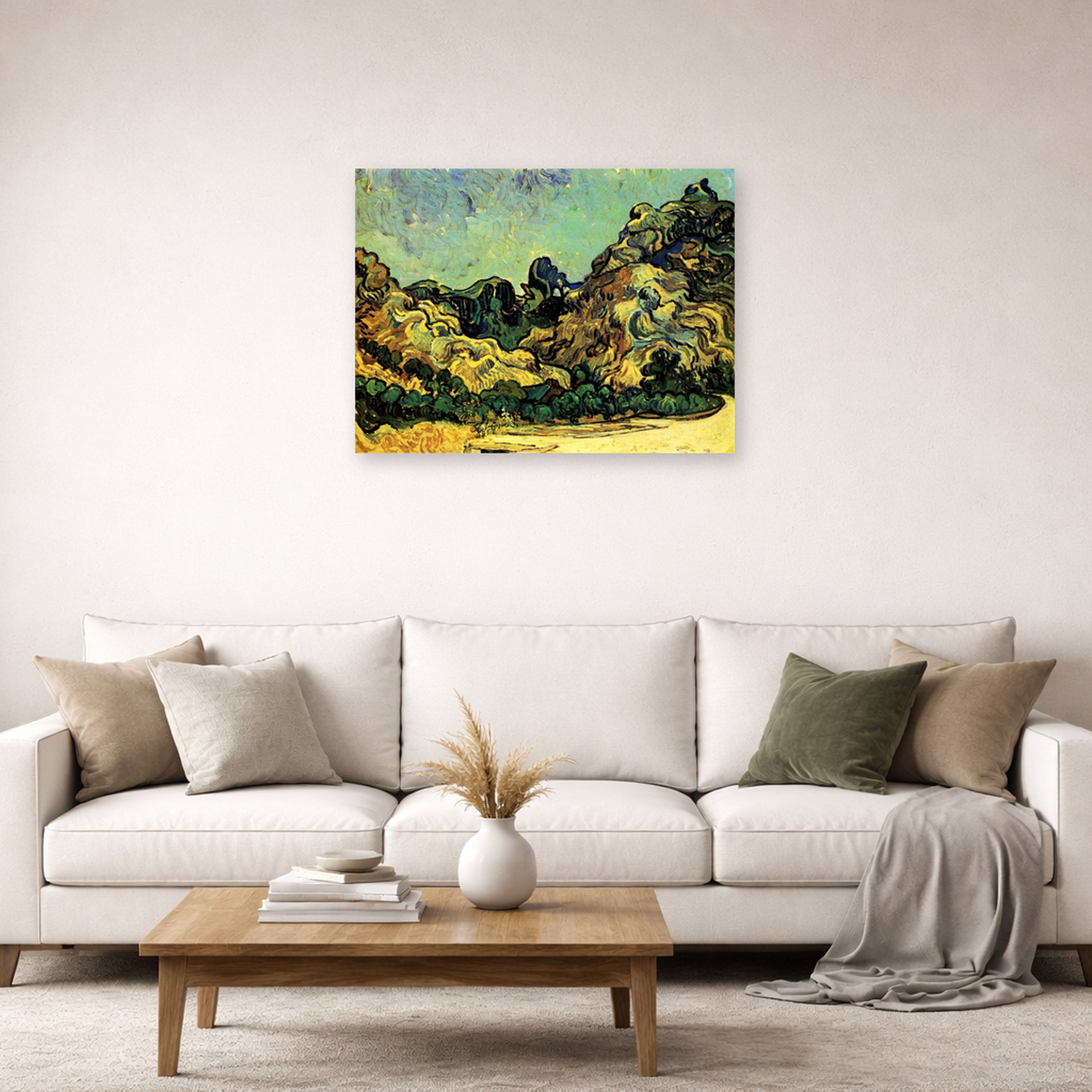 Unframed poster print of Vincent van Gogh's Mountains at Saint Remy with Dark Cottage displayed on a wall in a living room