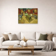 Unframed poster print of Vincent van Gogh's Night Café displayed on a wall in a living room