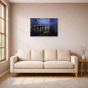 Gallery-wrapped canvas print of Vincent van Gogh's Night over the Rhone displayed on a wall in a living room