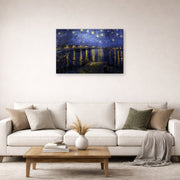 Gallery-wrapped canvas print of Vincent van Gogh's Night over the Rhone displayed on a wall in a living room