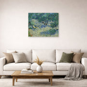 Unframed poster print of Vincent van Gogh's Olive Orchard displayed on a wall in a living room