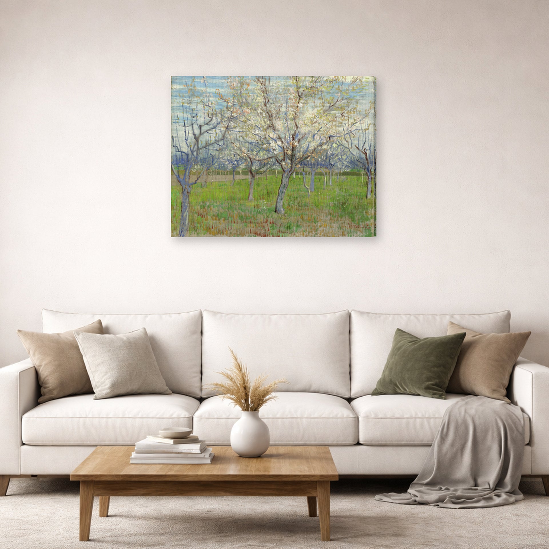 Gallery-wrapped canvas print of Vincent van Gogh's Orchard with Blossoming Apricot Trees displayed on a wall in a living room