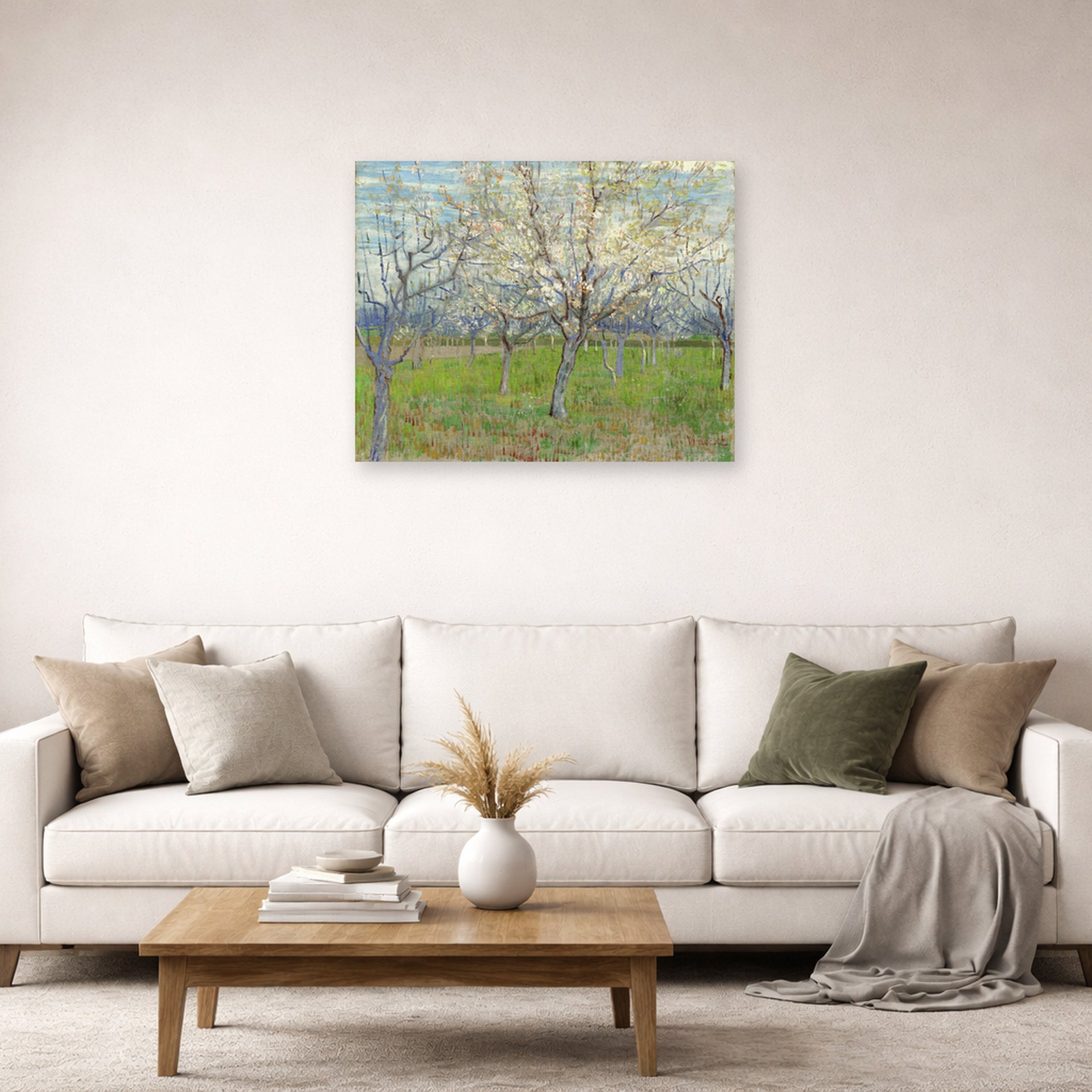 Unframed poster print of Vincent van Gogh's Orchard with Blossoming Apricot Trees displayed on a wall in a living room