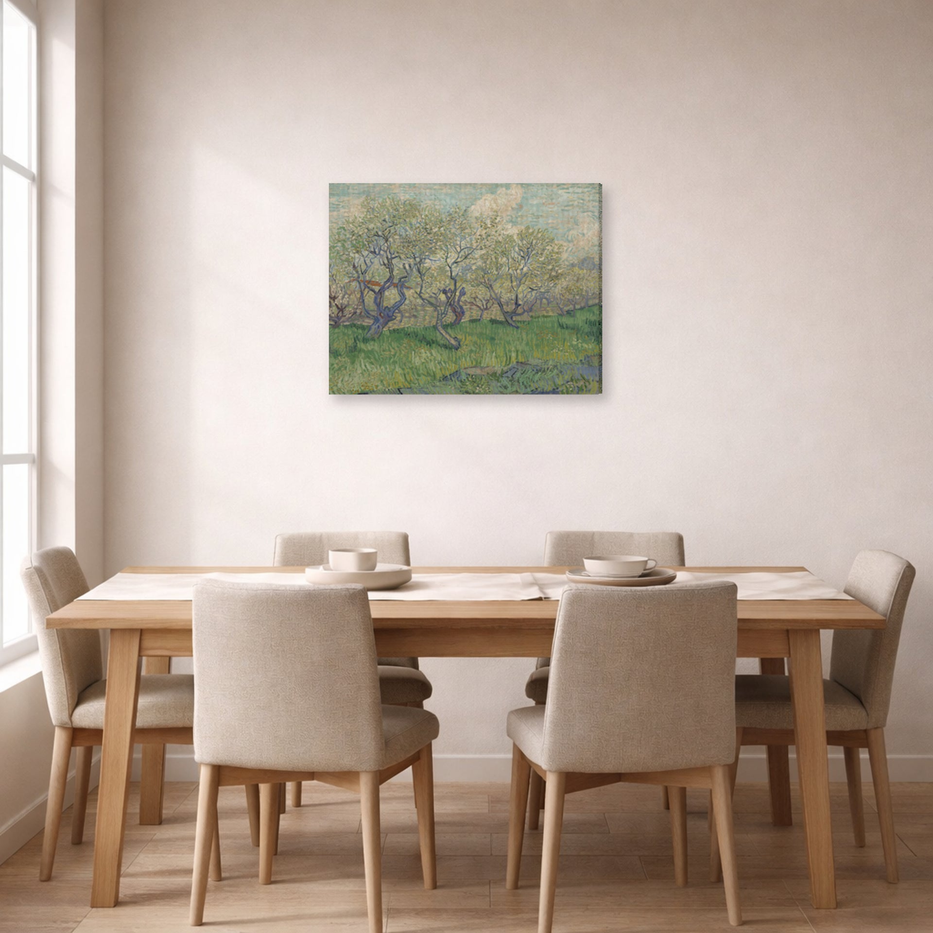 Gallery-wrapped canvas print of Vincent van Gogh's Orchard in Blossom displayed on a wall in a dining room