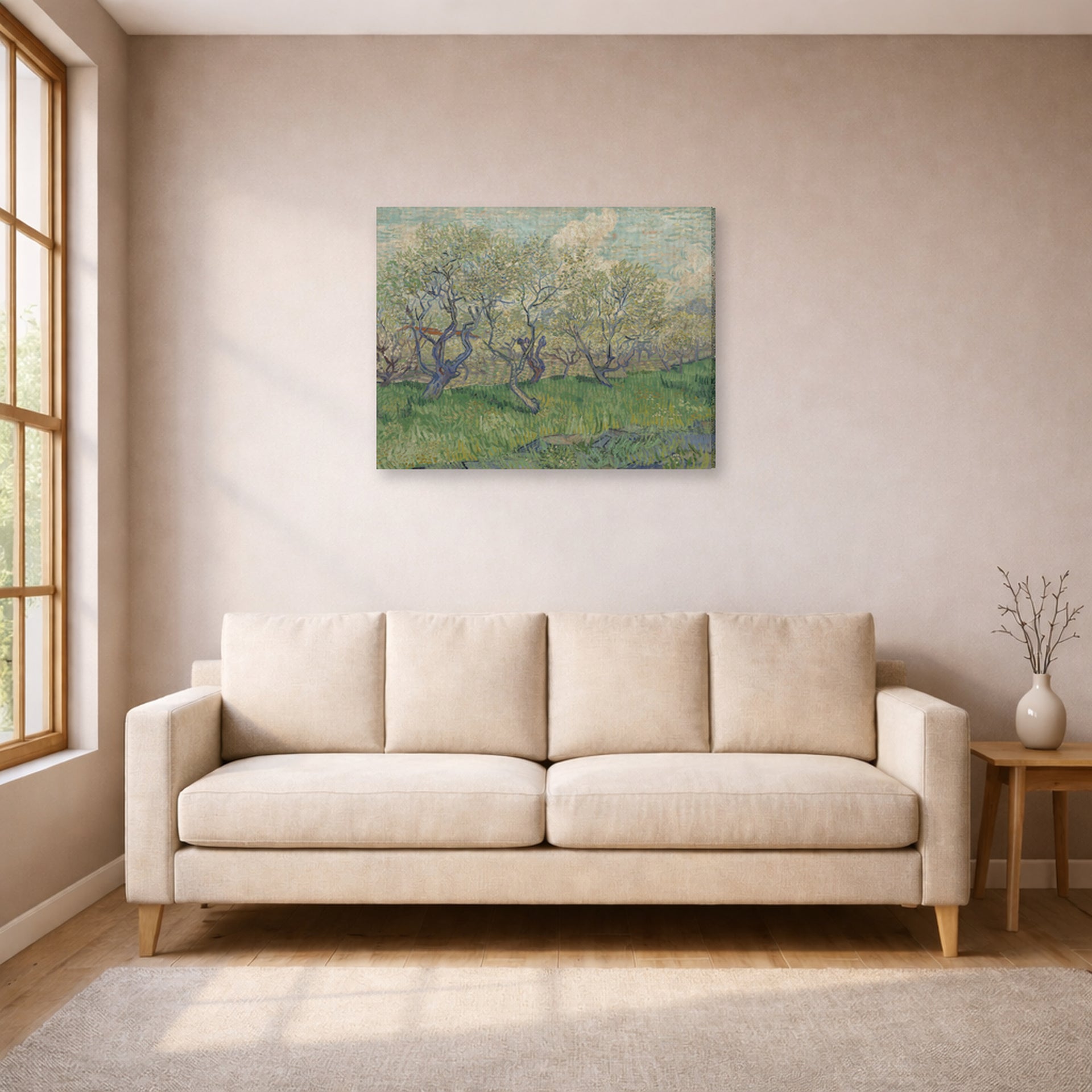 Gallery-wrapped canvas print of Vincent van Gogh's Orchard in Blossom displayed on a wall in a living room