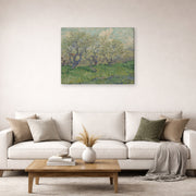 Gallery-wrapped canvas print of Vincent van Gogh's Orchard in Blossom displayed on a wall in a living room