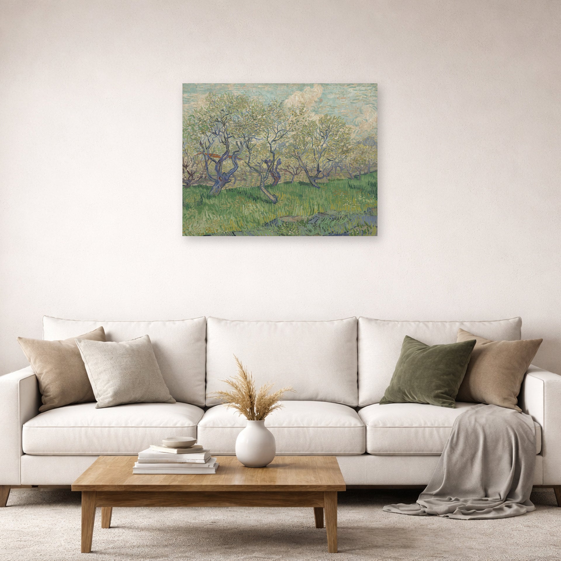 Unframed poster print of Vincent van Gogh's Orchard in Blossom displayed on a wall in a living room