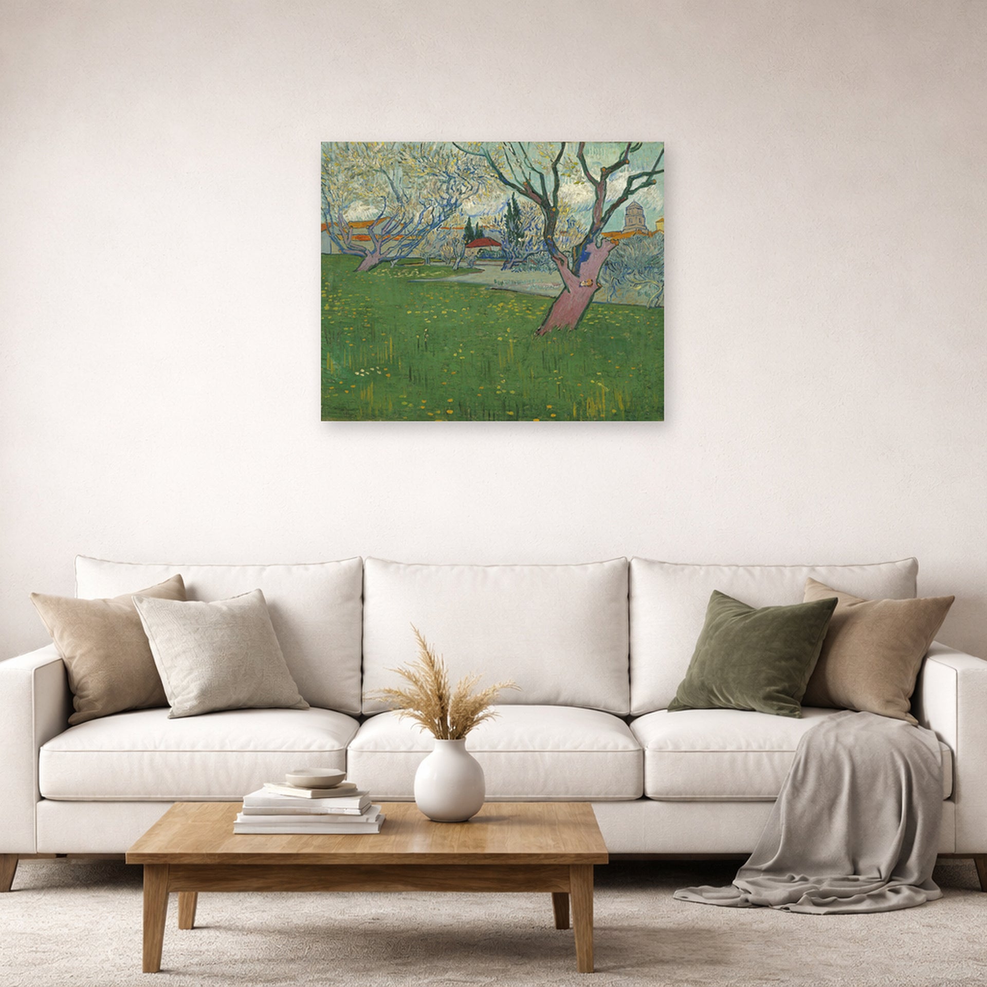 Unframed poster print of Vincent van Gogh's Orchards in Blossom, View of Arles displayed on a wall in a living room