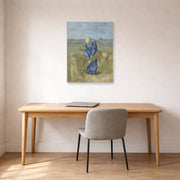Unframed poster print of Vincent van Gogh's Peasant Woman Binding Sheaves displayed on a wall in a home office