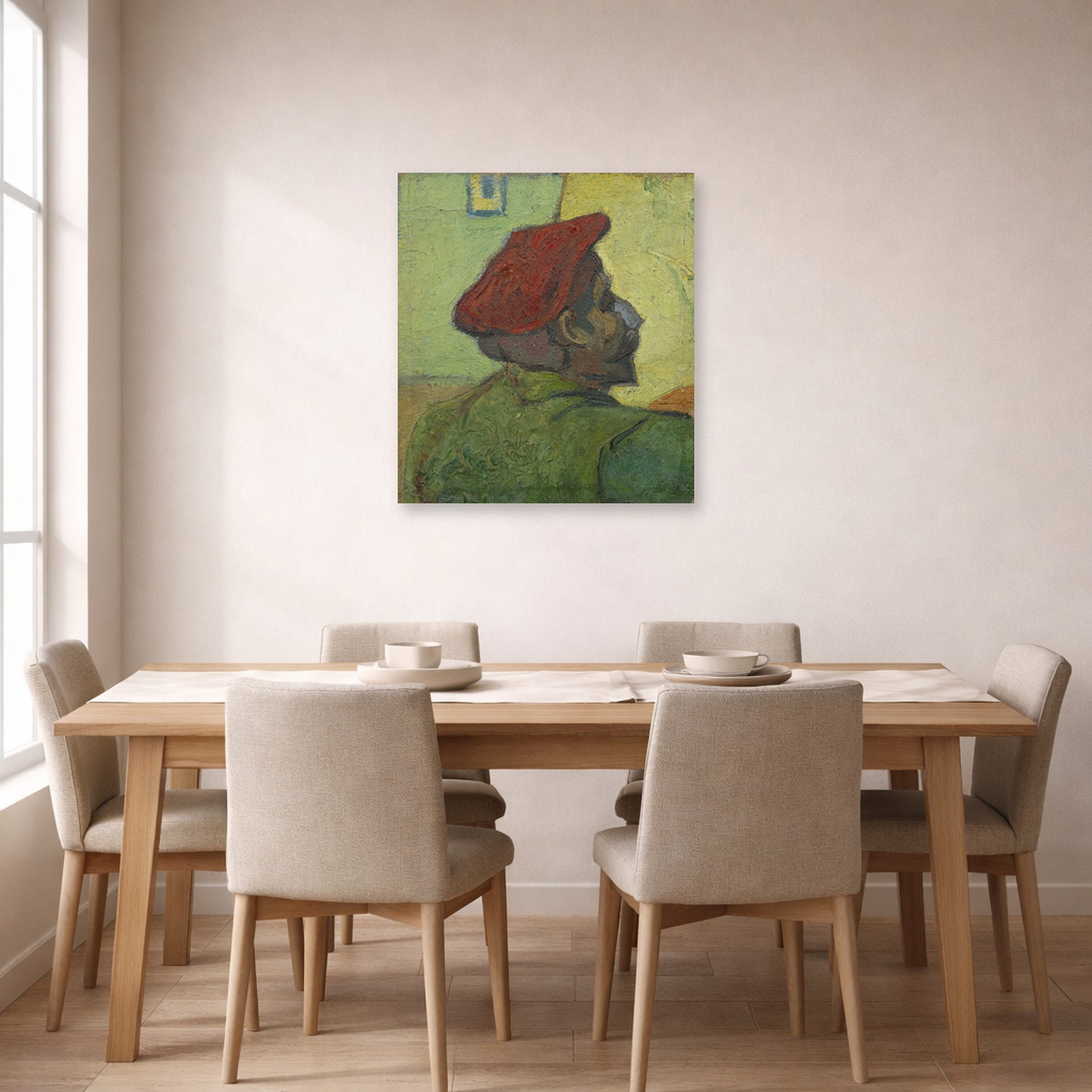 Unframed poster print of Vincent van Gogh's Portrait of Gauguin displayed on a wall in a dining room