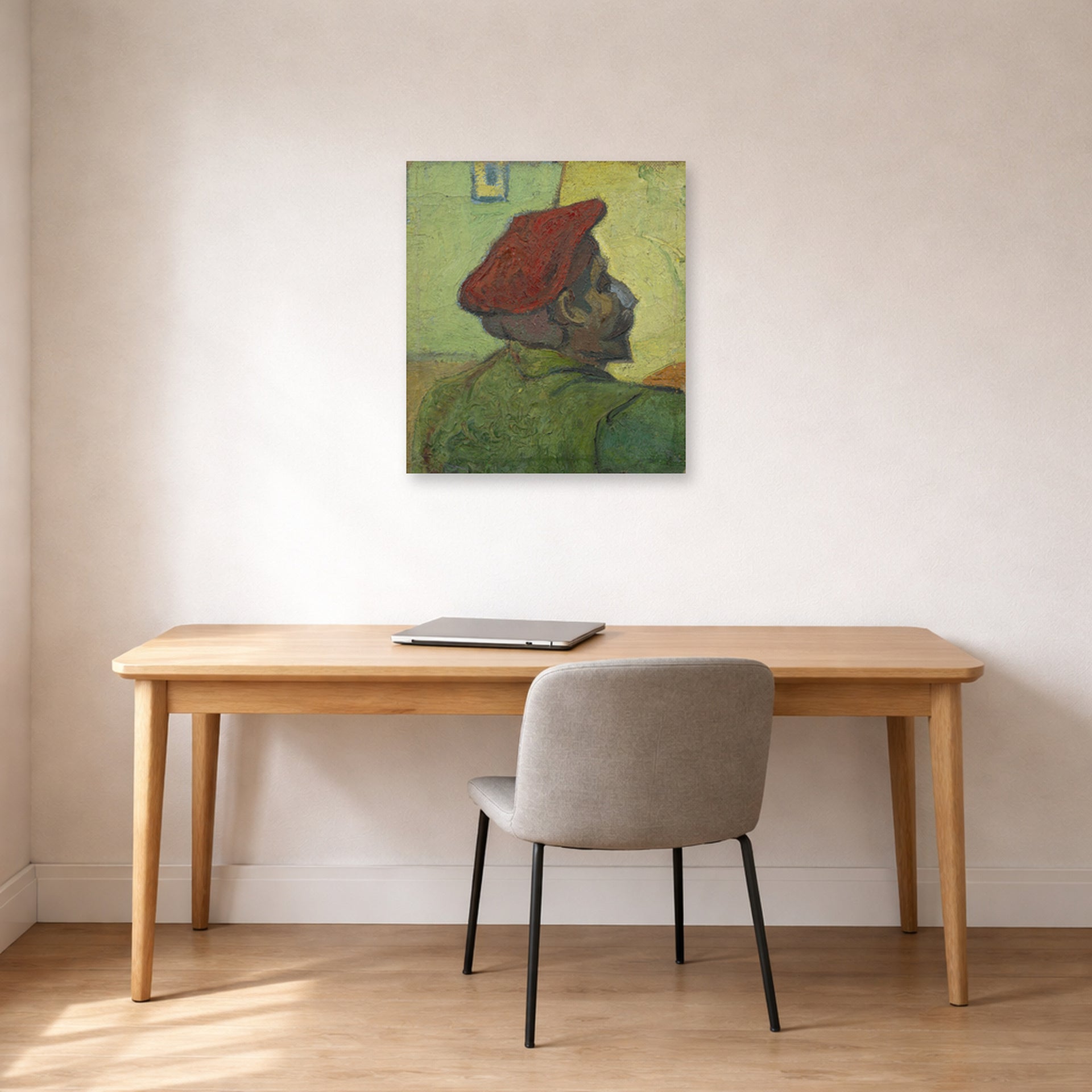 Unframed poster print of Vincent van Gogh's Portrait of Gauguin displayed on a wall in a home office