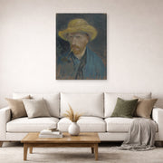 Gallery-wrapped canvas print of Vincent van Gogh's Self Portrait with Straw Hat and Pipe displayed on a wall in a living room