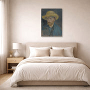 Unframed poster print of Vincent van Gogh's Self Portrait with Straw Hat and Pipe displayed on a wall in a bedroom