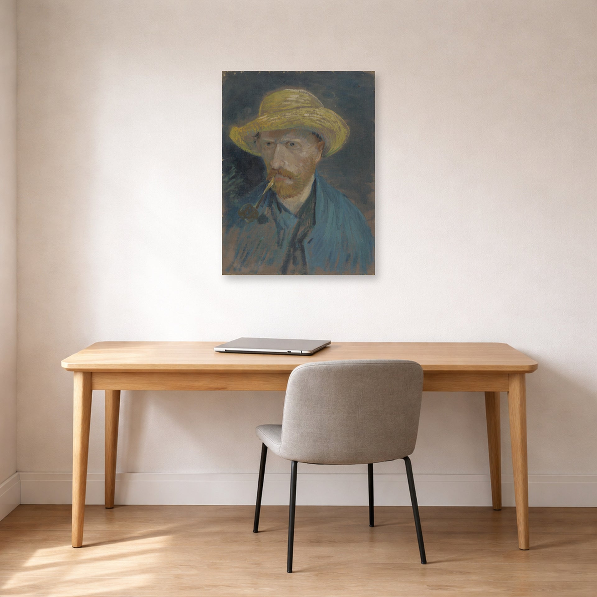 Unframed poster print of Vincent van Gogh's Self Portrait with Straw Hat and Pipe displayed on a wall in a home office