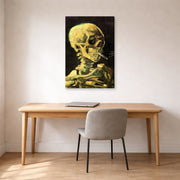Gallery-wrapped canvas print of Vincent van Gogh's Skull with Burning Cigarette displayed on a wall in a home office
