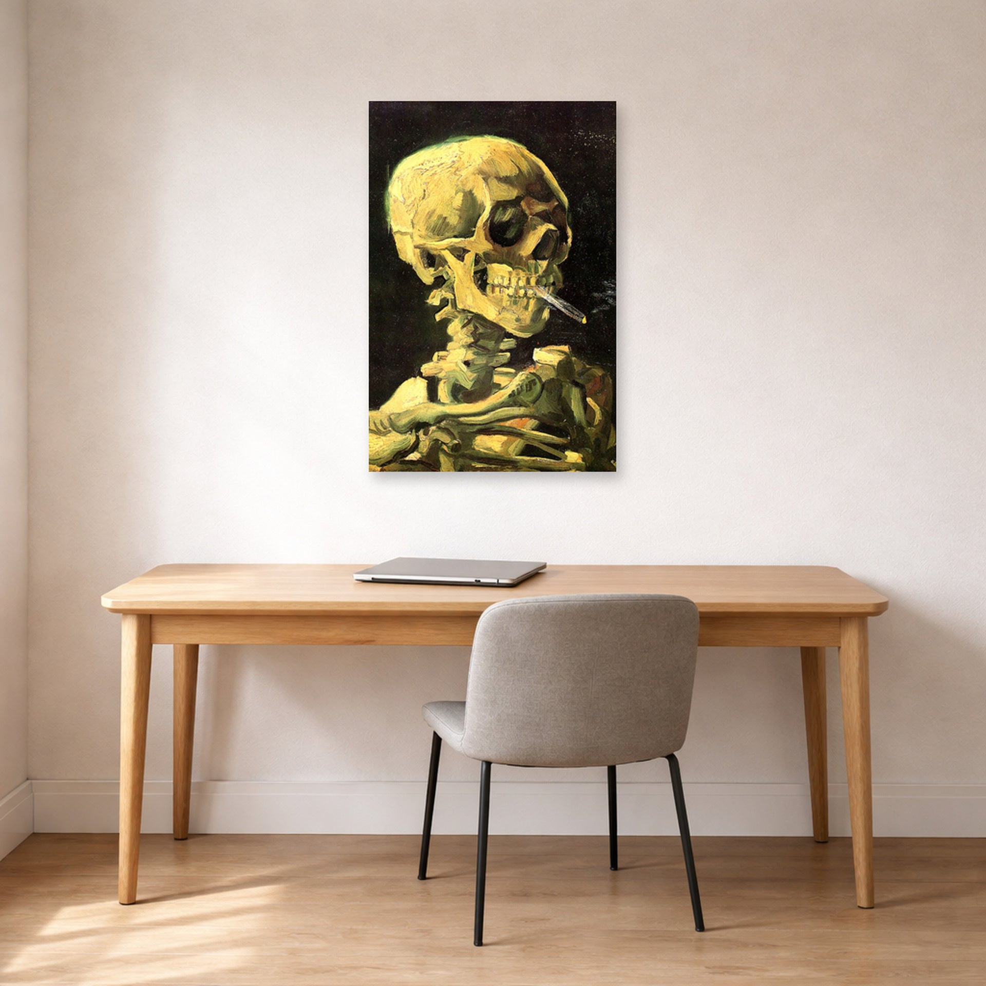 Unframed poster print of Vincent van Gogh's Skull with Burning Cigarette displayed on a wall in a home office