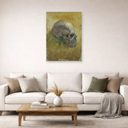 Unframed poster print of Vincent van Gogh's Skull displayed on a wall in a living room