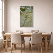 Gallery-wrapped canvas print of Vincent van Gogh's Small Pear Tree in Blossom displayed on a wall in a dining room