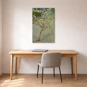 Gallery-wrapped canvas print of Vincent van Gogh's Small Pear Tree in Blossom displayed on a wall in a home office