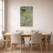 Unframed poster print of Vincent van Gogh's Small Pear Tree in Blossom displayed on a wall in a dining room