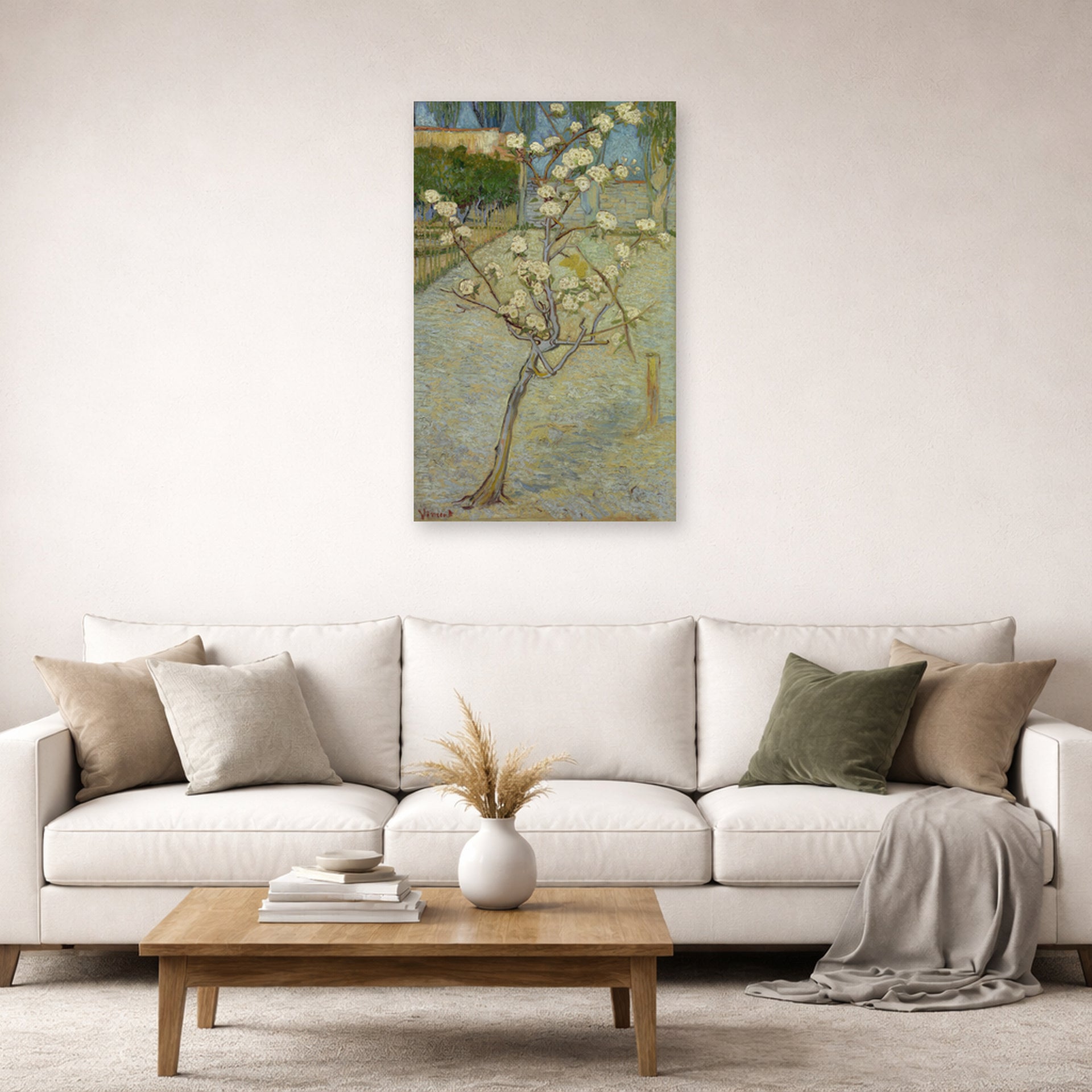 Unframed poster print of Vincent van Gogh's Small Pear Tree in Blossom displayed on a wall in a living room