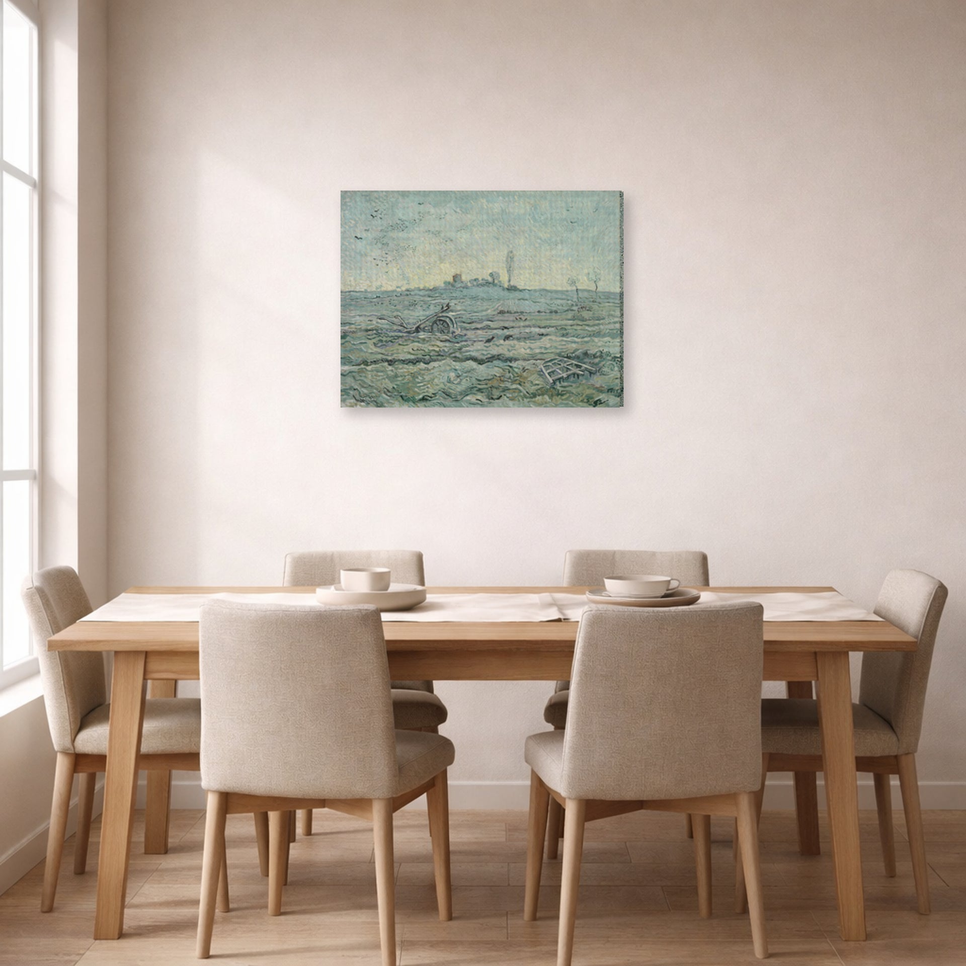 Gallery-wrapped canvas print of Vincent van Gogh's Snow Covered Field with a Harrow (after Millet) displayed on a wall in a dining room