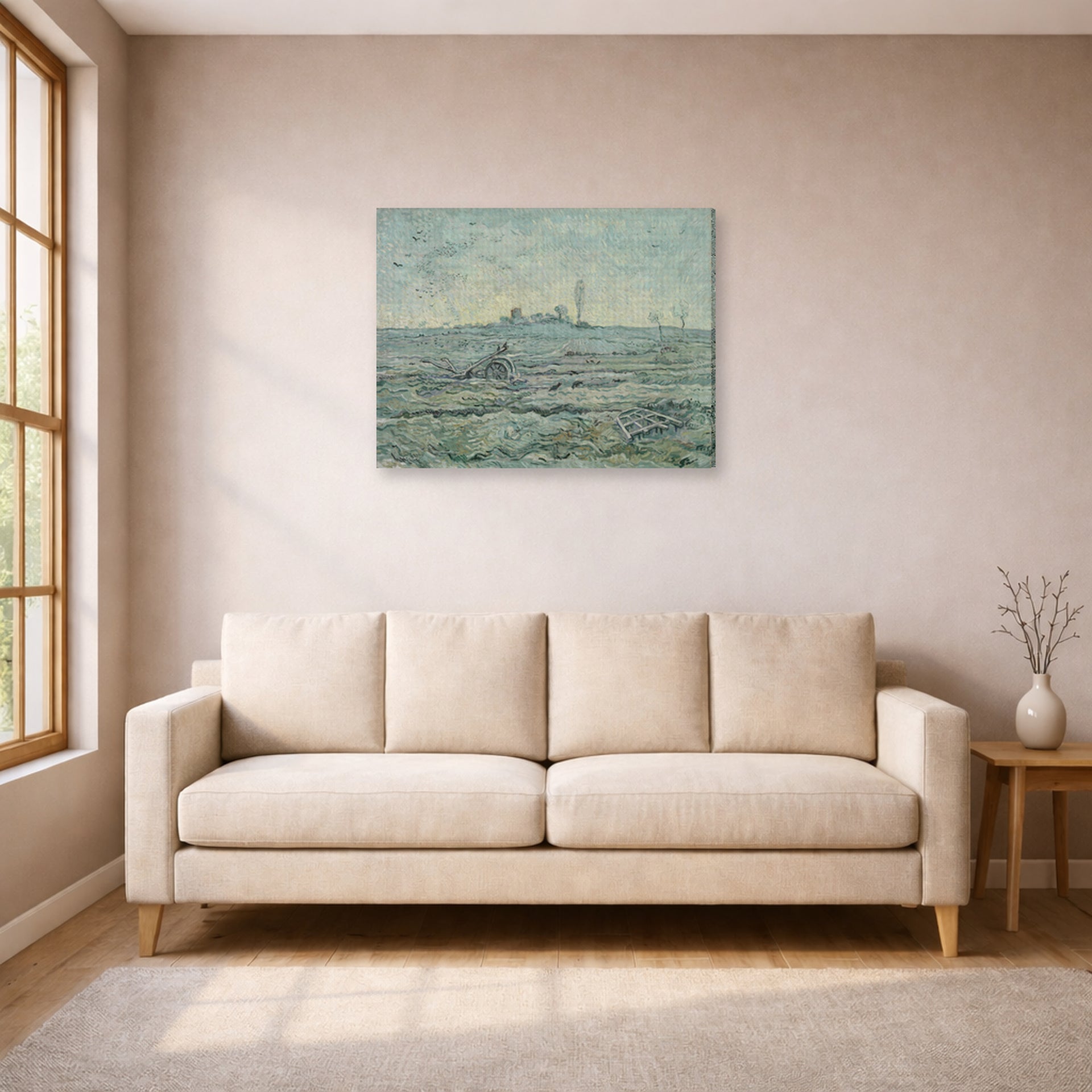 Gallery-wrapped canvas print of Vincent van Gogh's Snow Covered Field with a Harrow (after Millet) displayed on a wall in a living room